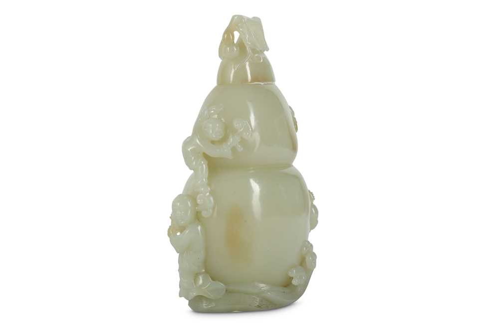 Lot 911 - A CHINESE CARVED JADE DOUBLE GOURD 'BOYS'