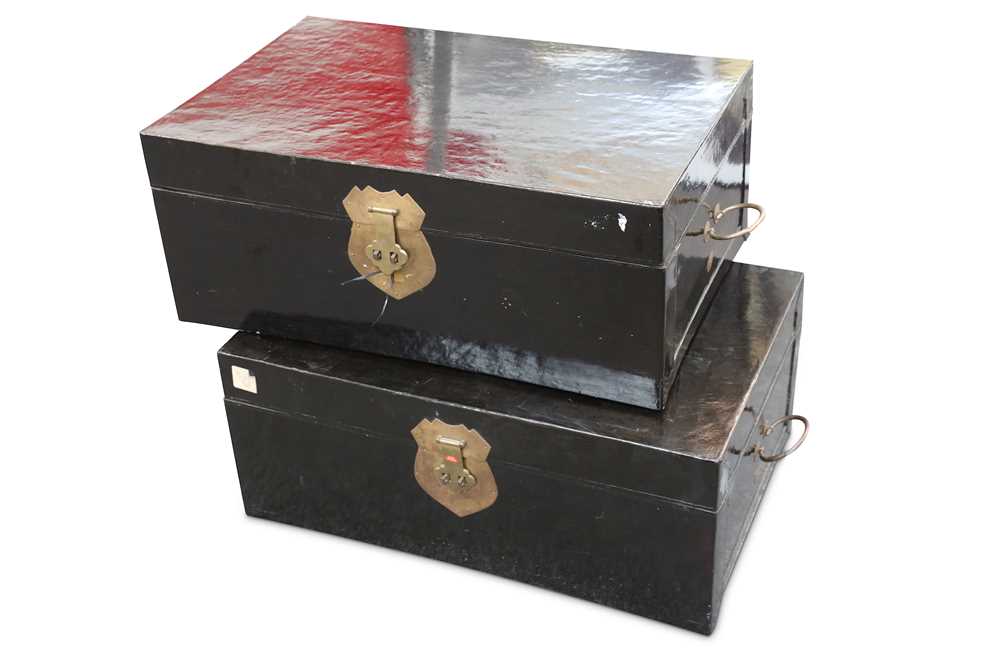 Lot 368 - A pair of Chinese black lacquered trunks with...