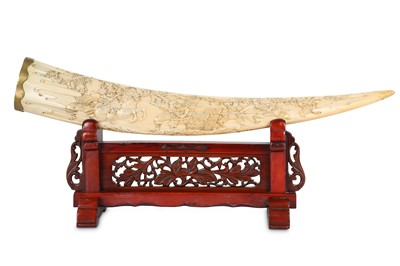 Lot 1073 - A CARVED MARINE IVORY OKIMONO ON A STAND....