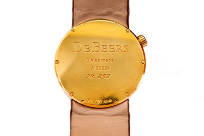Lot 380 - DE BEERS. A LADIES 18K YELLOW GOLD AND ON...