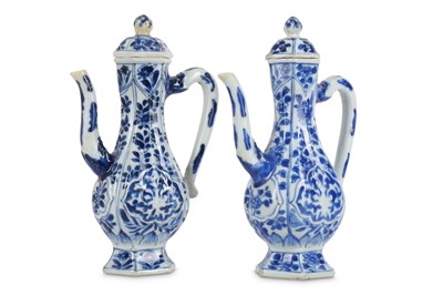 Lot 555 - A NEAR PAIR OF CHINESE BLUE AND WHITE EWERS...