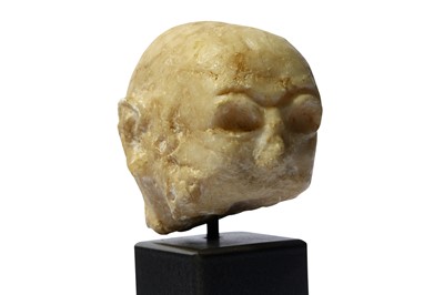 Lot 83 - AN ALABASTER SUMERIAN HEAD Circa 2200 B.C. The...