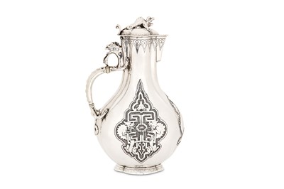 Lot 311 - A Victorian sterling silver ewer, London 1851...