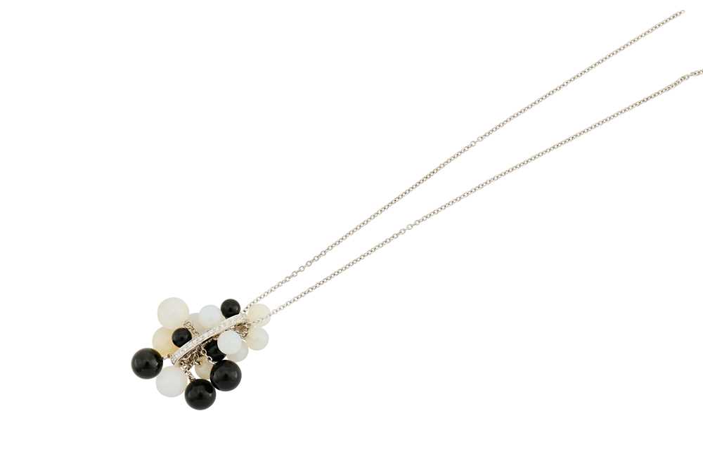 Lot 40 - A diamond, onyx and agate pendant necklace