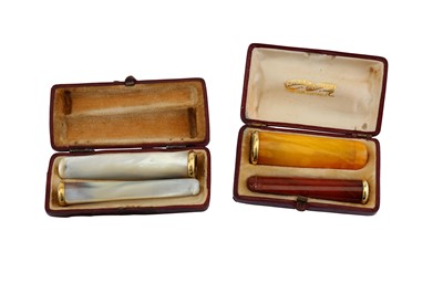 Lot 154 - Two cased French 18 carat gold mounted smoking...