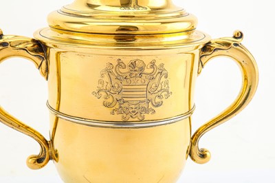 Lot 316 - A George II sterling silver-gilt twin handled...