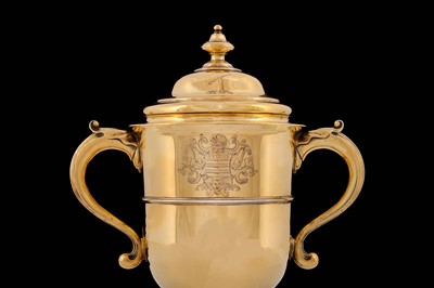 Lot 316 - A George II sterling silver-gilt twin handled...