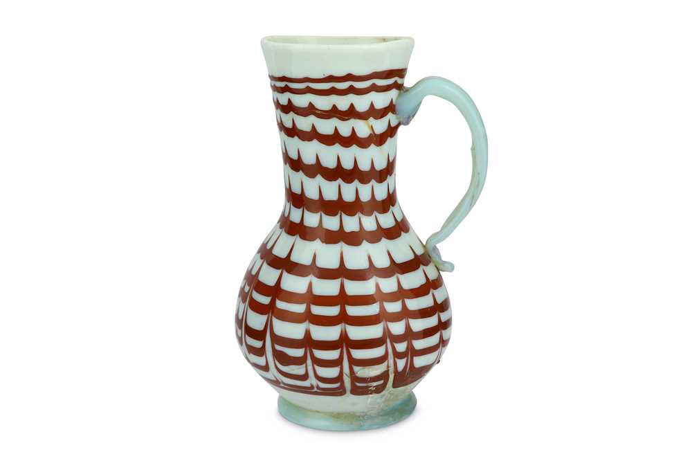 Lot 87 - A RED-ENAMELLED OPALESCENT WHITE BLOWN GLASS JUG