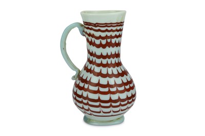 Lot 87 - A RED-ENAMELLED OPALESCENT WHITE BLOWN GLASS JUG