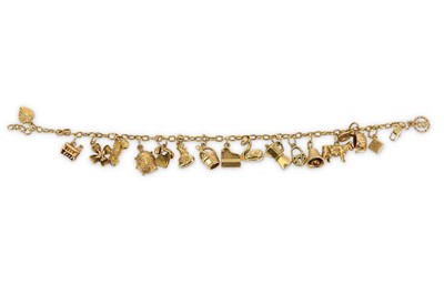 Lot 387 - A charm bracelet, the cable-link chain,...