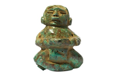 Lot 227 - A PRE-COLUMBIAN STONE FIGURE Carved in mottled...