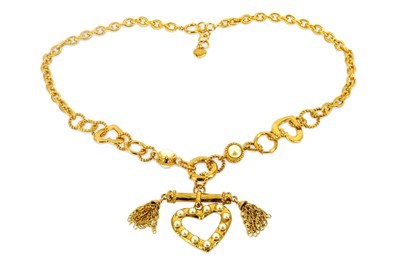 Lot 767 - Moschino Heart And Tassel Necklace, gilt tone...