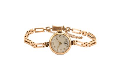 Lot 597 - COCKTAIL WATCH. A LADIES 14K YELLOW GOLD...
