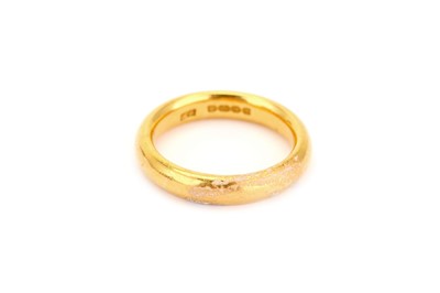 Lot 304 - A gold band ring, The polished 22 carat gold...