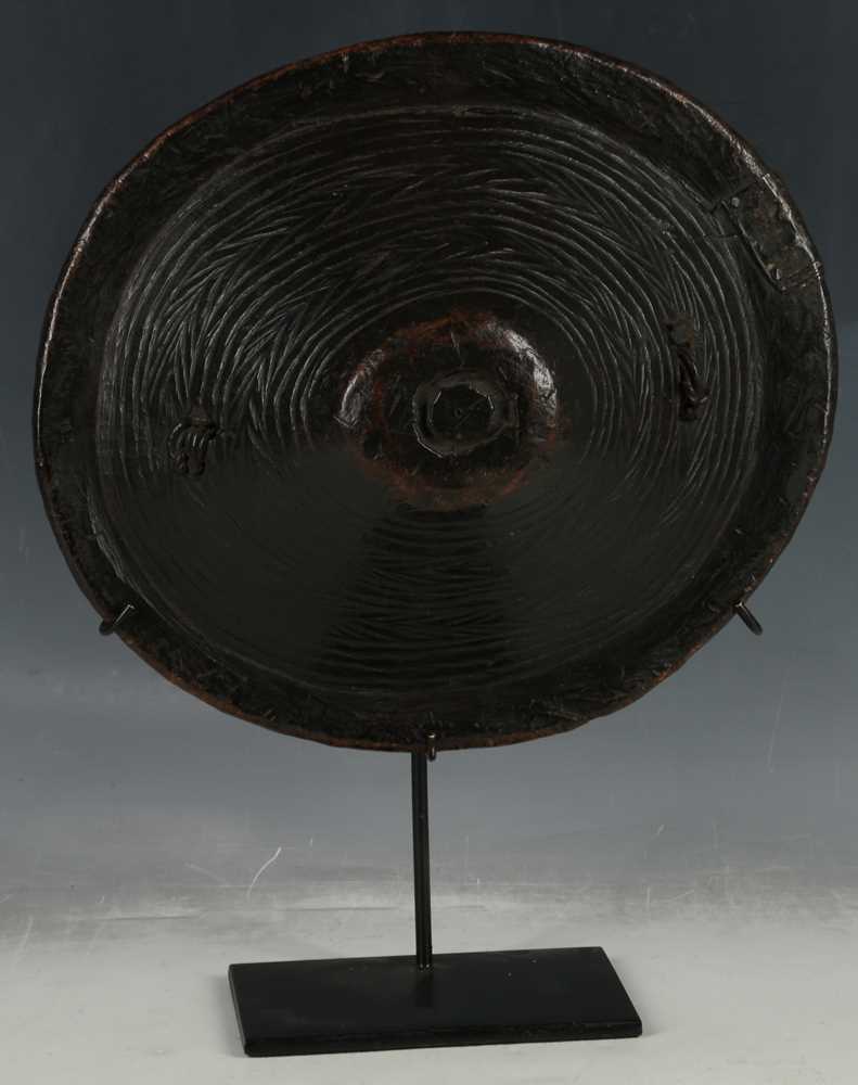 Lot 156 - African tribal wooden shield, carved grass