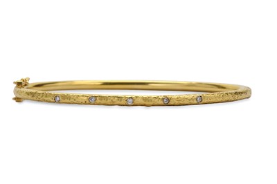 Lot 148 - A diamond-set bangle, the hinged bangle of...