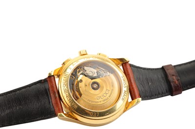 Lot 606 - GUCCI. A MEN'S 18K YELLOW GOLD AUTOMATIC...