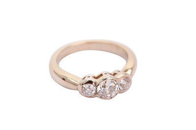 Lot 132 - A diamond three-stone ring, collet-set with...