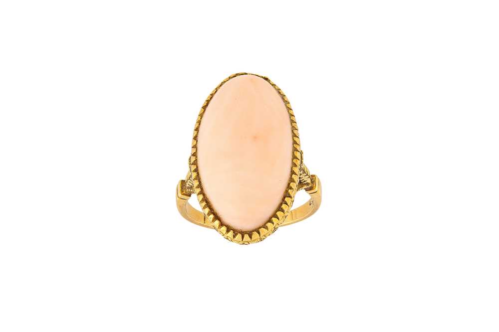Lot 48 - A coral ring, circa 1955 The oval cabochon...