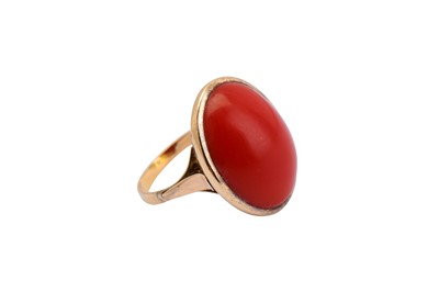 Lot 158 - A coral ring, the oval cabochon coral,...