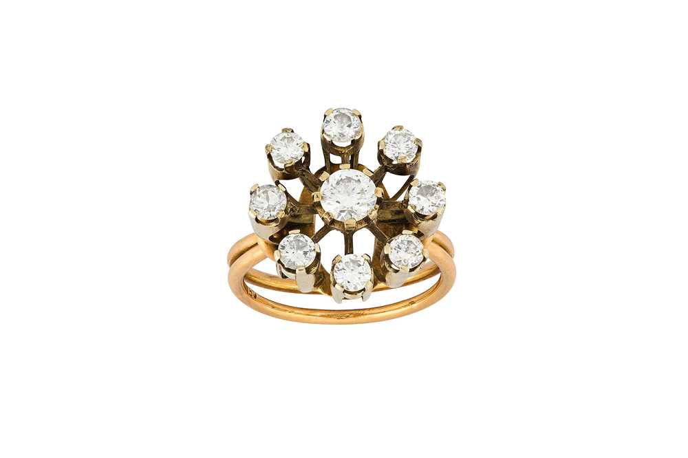 Lot 46 - A diamond cluster ring  The raised cluster of...