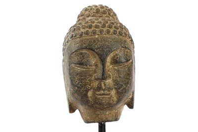 Lot 648 - A Chinese stone carving of a Buddha head...