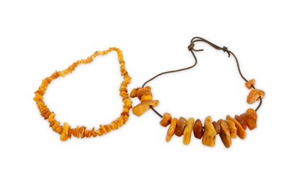 Lot 640 - A rough cut amber bead necklace formed of ...