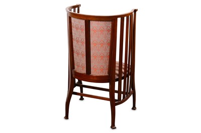 Lot 751 - An Arts and Crafts Liberty type walnut barrel...