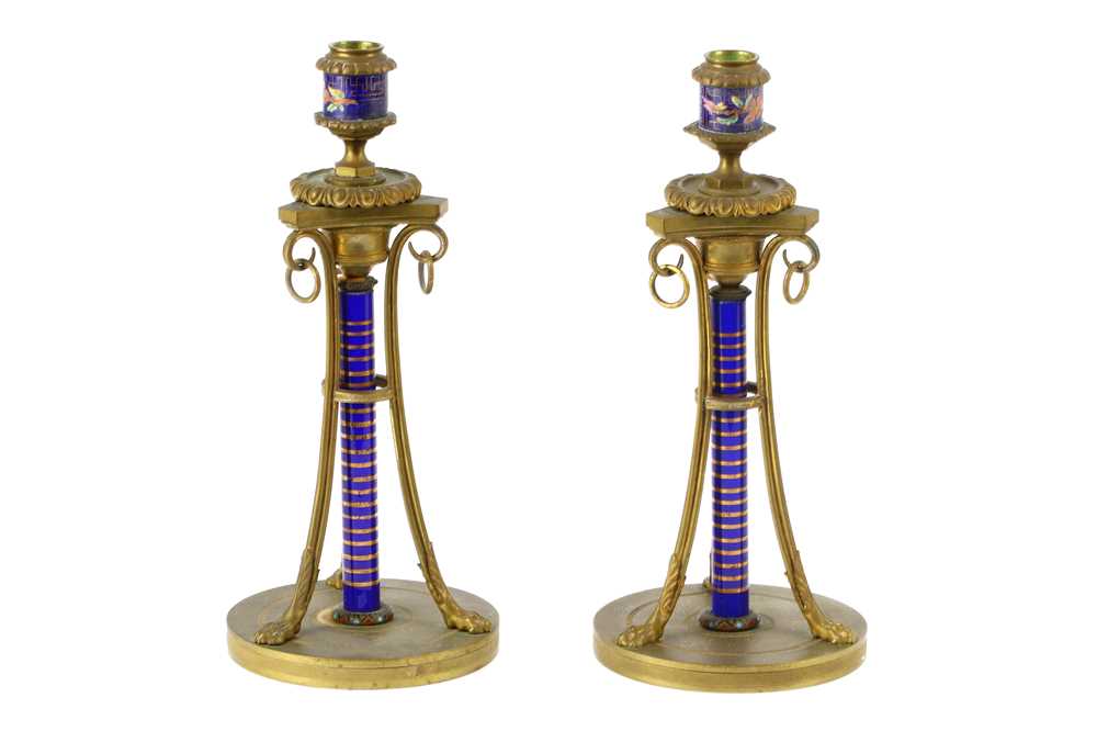 Lot 728 - A pair of 19th Century gilt metal candlesticks,...