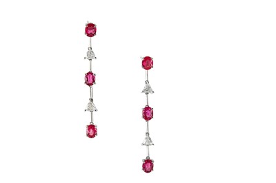 Lot 138 - A pair of pink sapphire and diamond earrings...
