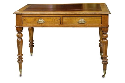 Lot 791 - A Victorian oak writing table with brown faux...