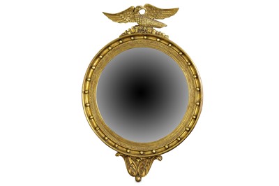 Lot 807 - A Regency style gilt mirror of circular form,...