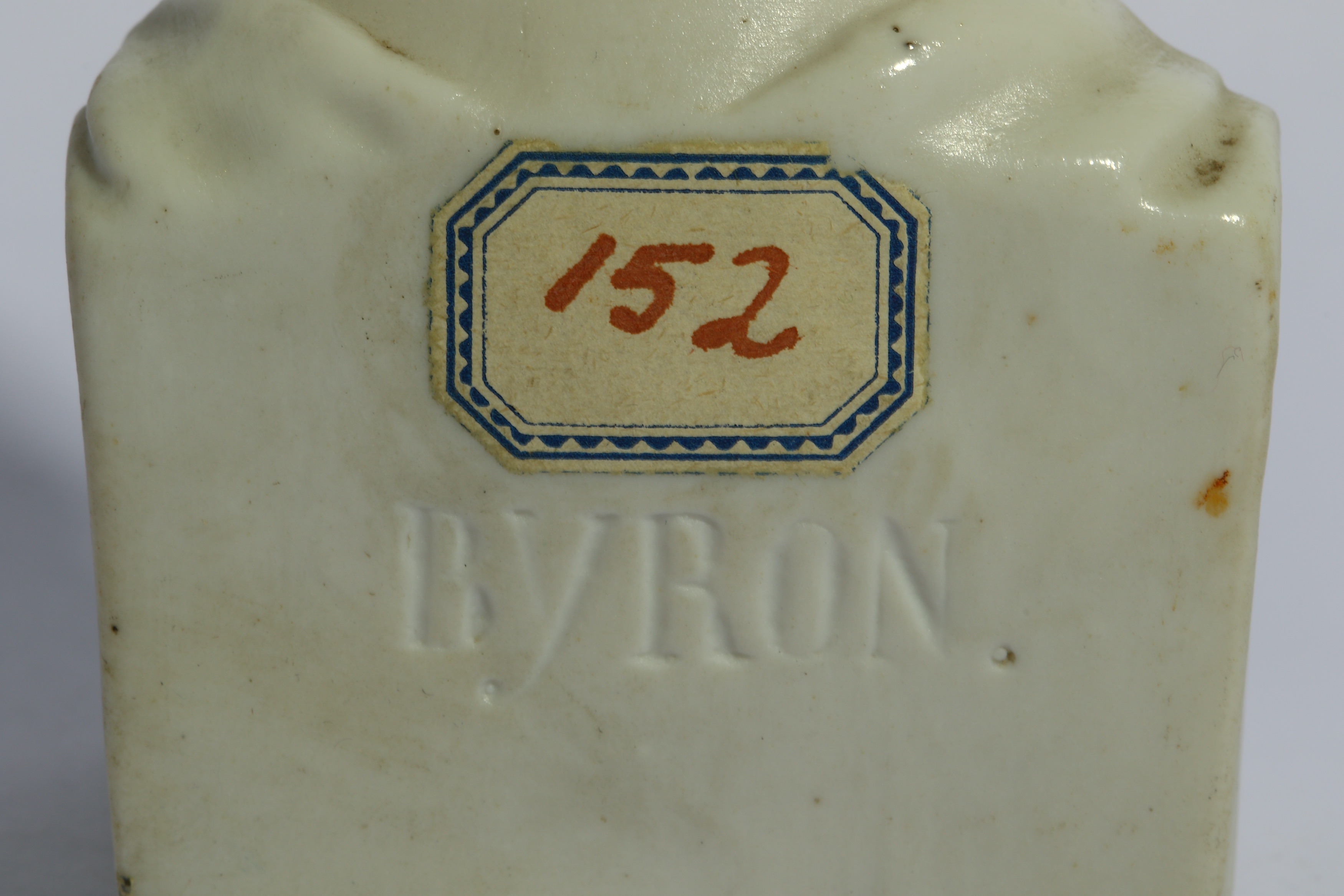 Lot 19 A WHITE PORCELAIN BISQUE BUST OF BYRON