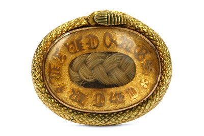 Lot 197 - A hairwork ring, the central hairwork...