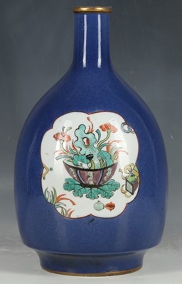 Lot 6 - An Asian porcelain bottle form vase, the blue...