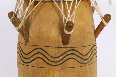 Lot 303 - AN AFRICAN WOOD DRUM With an ovoid body,...