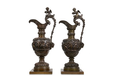Lot 79 - A PAIR OF LATE 19TH CENTURY BRONZE EWERS AFTER...
