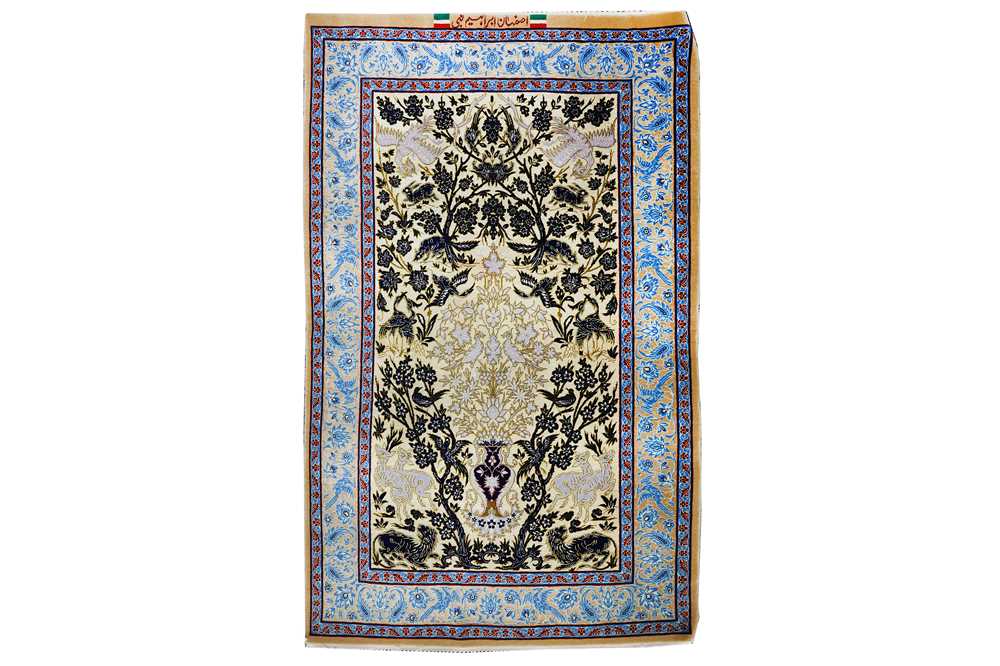 Lot 45 - AN EXTREMELY FINE PART SILK SIGNED ISFAHAN RUG,...