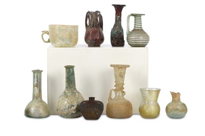 Lot 325 - A GROUP OF GLASS VESSELS Including a Roman...