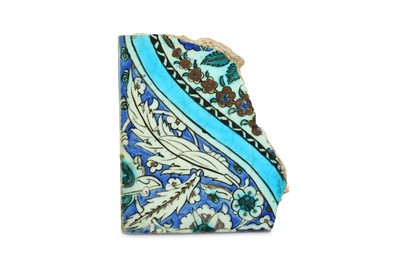 Lot 110 - A FRAGMENT OF A RED-PAINTED IZNIK POTTERY TILE