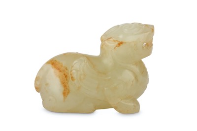 Lot 491 - A CHINESE PALE CELADON CARVING OF A QILIN. The...