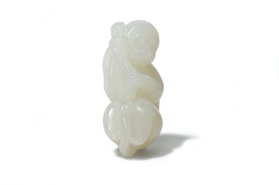 Lot 653 - A CHINESE WHITE JADE CARVING OF A MONKEY.