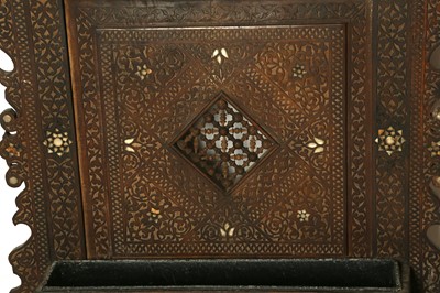 Lot 104 - λ A CARVED HARDWOOD MOTHER-OF-PEARL AND BONE-INLAID SYRIAN WALL PANEL