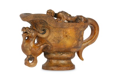Lot 576 - A CHINESE GILT-DECORATED ARCHAISTIC 'DRAGON' POURING VESSEL.