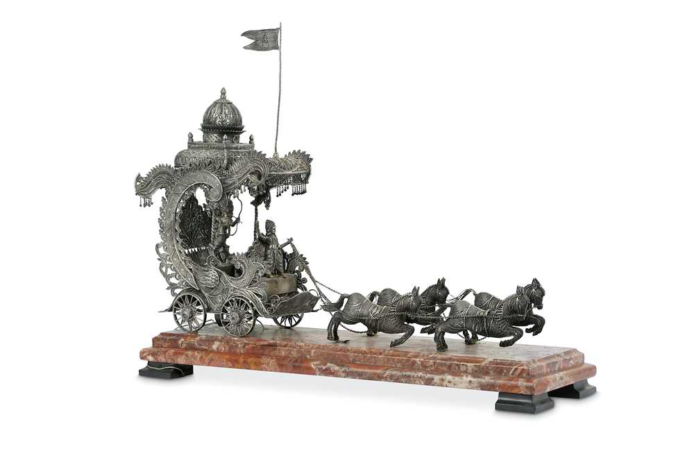 AN INDIAN WHITE METAL FILIGREE CENTREPIECE OF A CHARIOT PULLED BY FOUR...