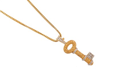 Lot 136 - A diamond and yellow sapphire key pendant...