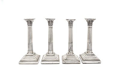 Lot 548 - A set of four George V sterling silver candlesticks, Sheffield 1919-22 by Harrison Brothers & Howson (George Howson)