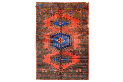 Lot 228 - A rug with Kazak type designs on a red field,...