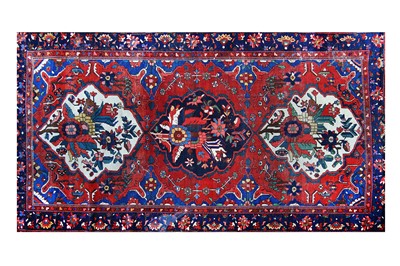 Lot 240 - A Persian Bakthiar rug, with three medallions...