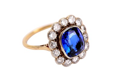 Lot 167 - A synthetic sapphire and diamond cluster ring,...